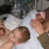 Touching Photo of a Young Boy Helping His Father Give Skin-to-Skin Contact to Premature Twins Goes Viral