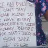 Mom Puts Sign On Daughter's Back So Others Will Stop Shaming Her At The Grocery Store